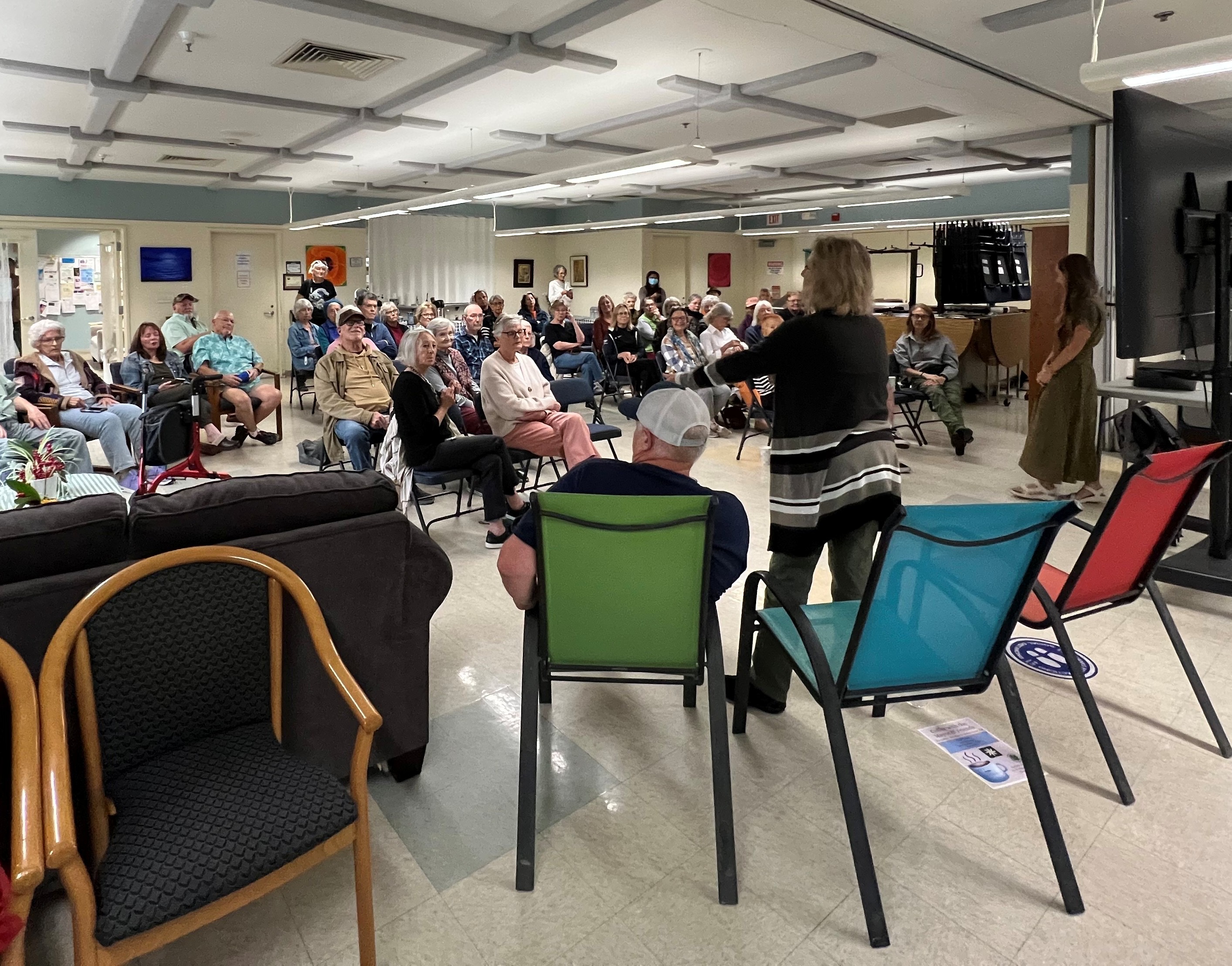 Attendees engaging at Coffee with the Mayor event